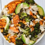 Creamy tahini dressing drizzled over roasted chickpeas & veggies.
