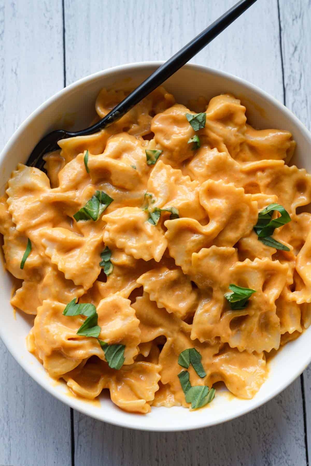Healthy Sweet Potato & Miso sauce with bow-tie pasta in a bowl.