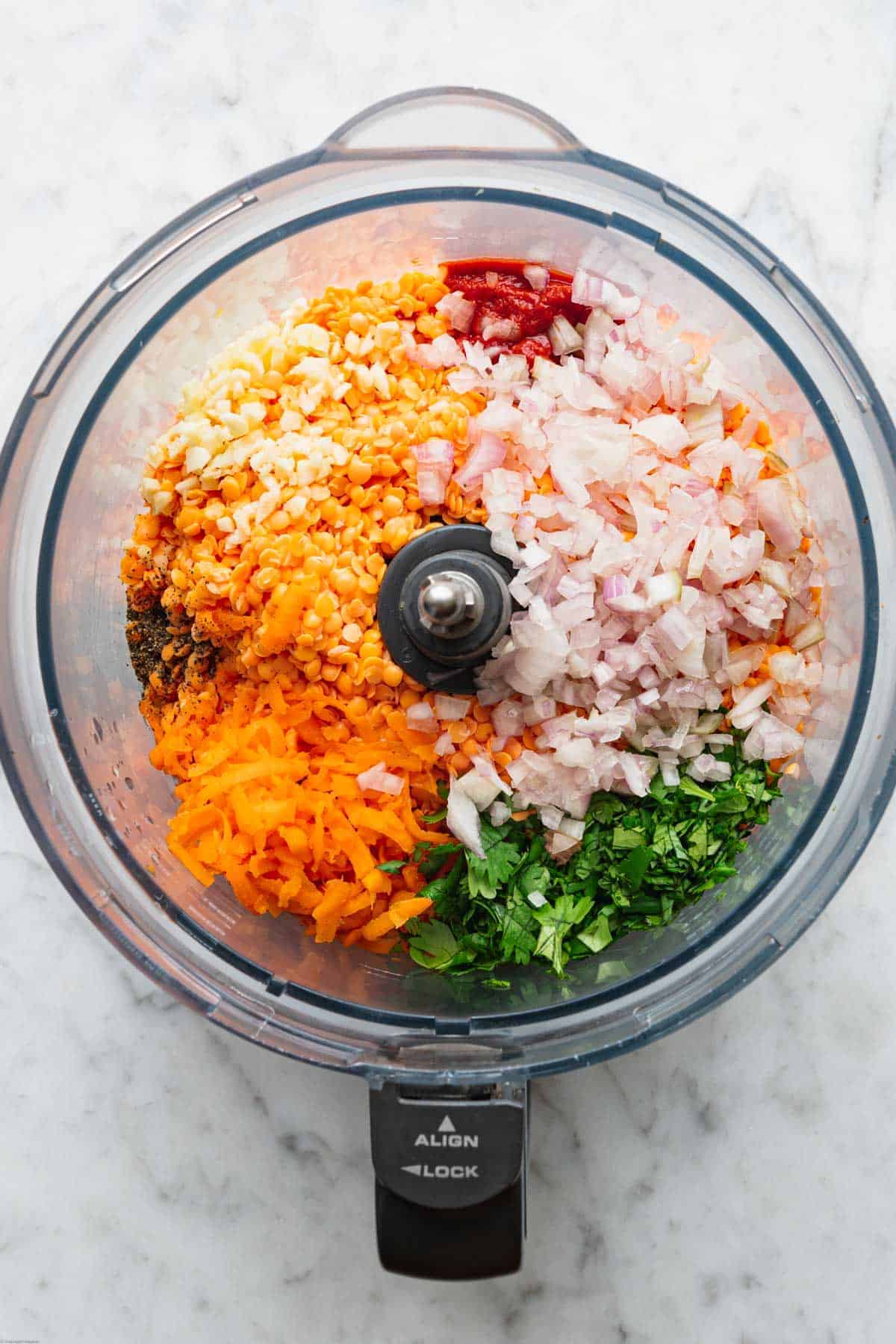 Soaked red lentils, carrots, cilantro, shallots, tomato paste, garlic, salt and pepper in a food processor.