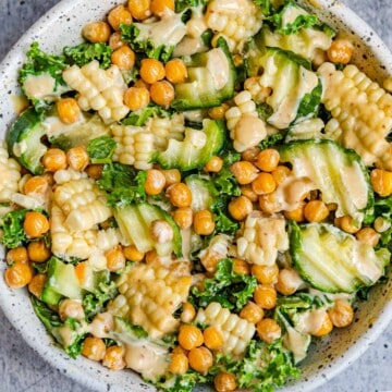 Crispy chickpeas, crinkle cut cucumber, sweet corn kernels, and lettuce salad with creamy dressing.