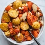 Roast potatoes, carrots, grape tomatoes, garlic, and white beans tossed with olive oil and fresh herbs.