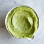 Avocado crema in a small white bowl.