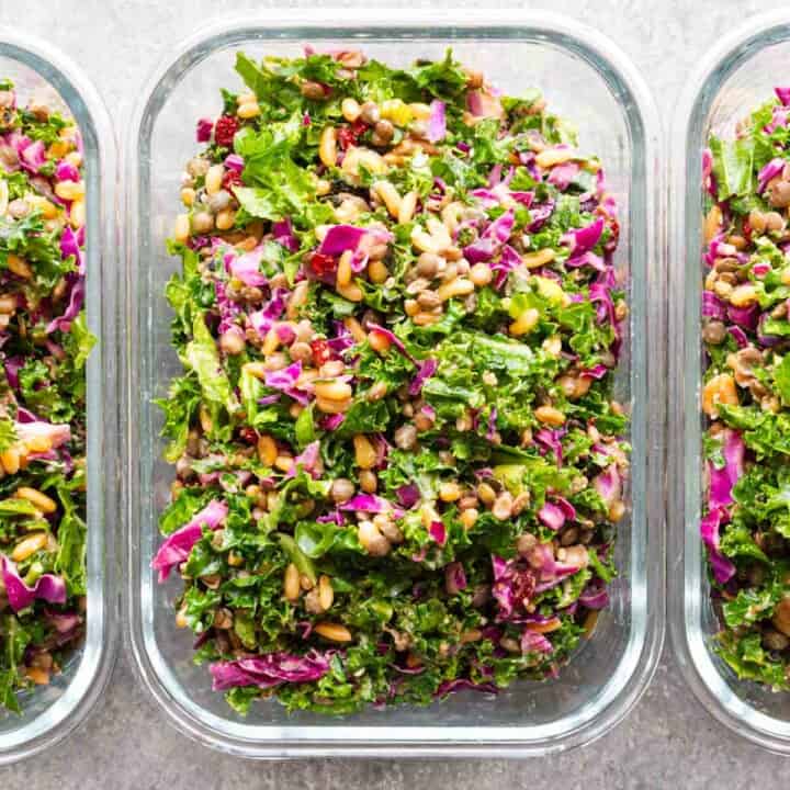 Healthy high-protein meal-prep salad in three glass containers.