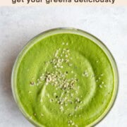 Green miso sauce in a glass bowl with hemp hearts.