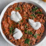 Easy creamy black bean chili with peanut butter in a white bowl.