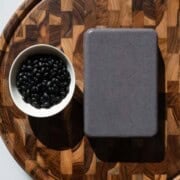 Beans tofu on a wooden cutting board.