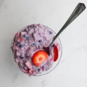 High-protein oatmeal with chia seeds & yogurt in a glass bowl.