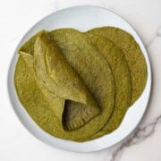 Quinoa spinach wraps on a white plate.