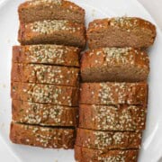 Gluten-free zucchini bread sliced on a white plate.