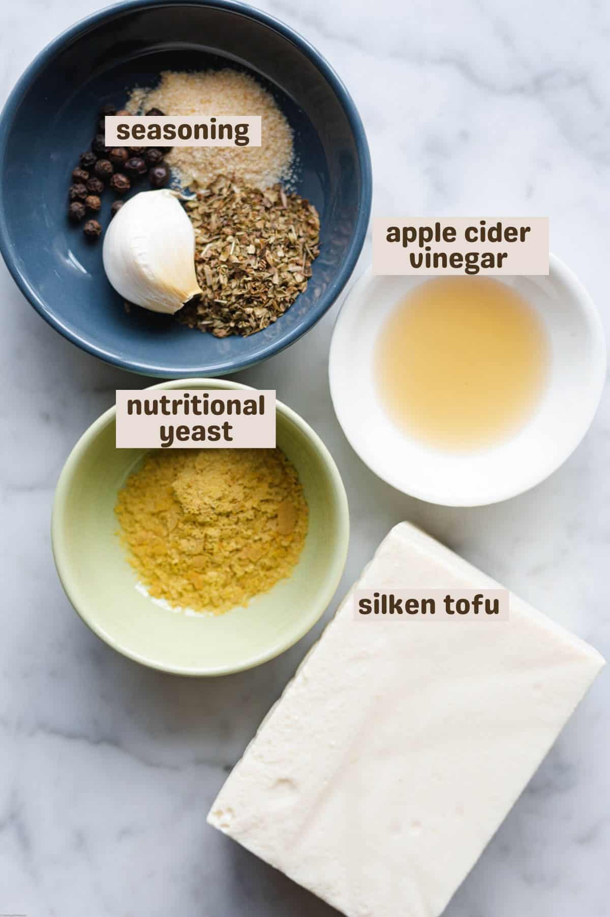 Silken tofu, nutritional yeast, seasoning, and apple cider vinegar.