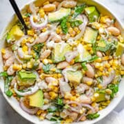 Creamy lemon pepper dressing with High-Protein Bean & Corn Salad: shallot, avocado, corn, basil, jalapeño, pepitas, and white beans.