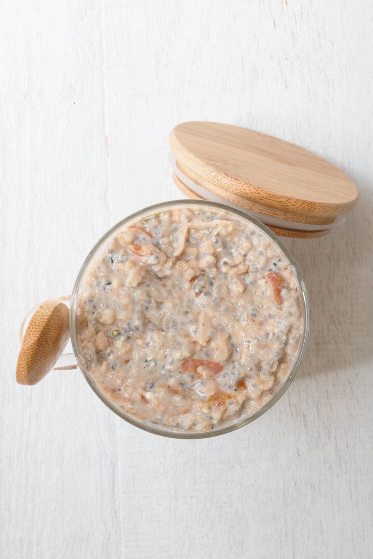 High-protein apple cinnamon chia seed oatmeal in a jar.