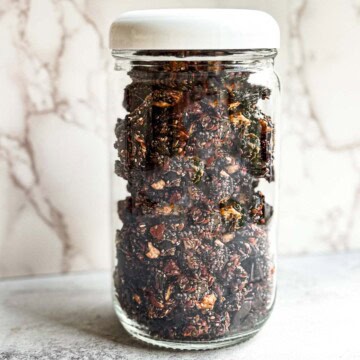 Healthy grain-free granola in a glass jar with lid.