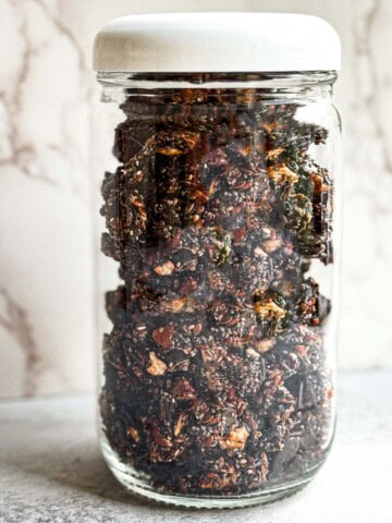 Healthy grain-free granola in a glass jar with lid.