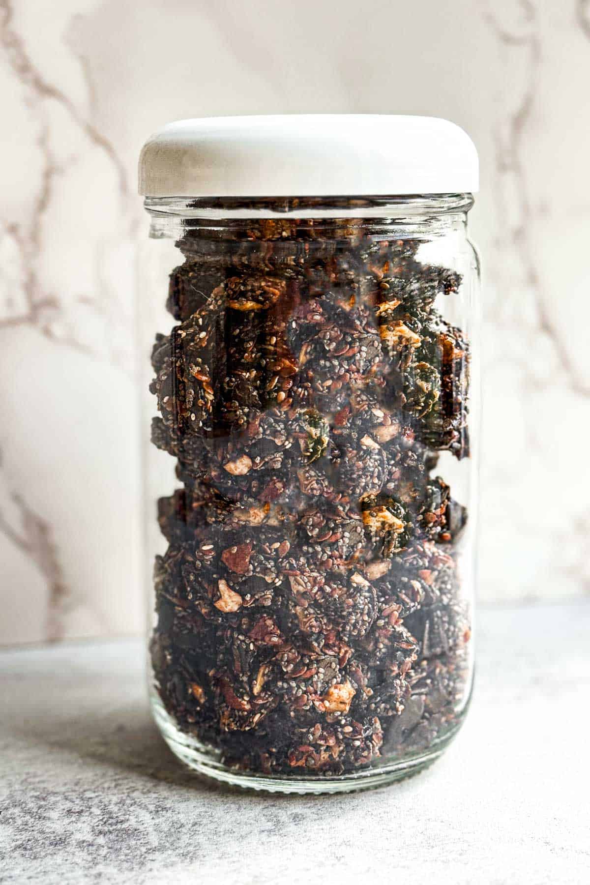 Crunchy and healthy grain-free granola in a glass jar.
