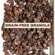 Crunchy and healthy grain-free granola on a white baking sheet.