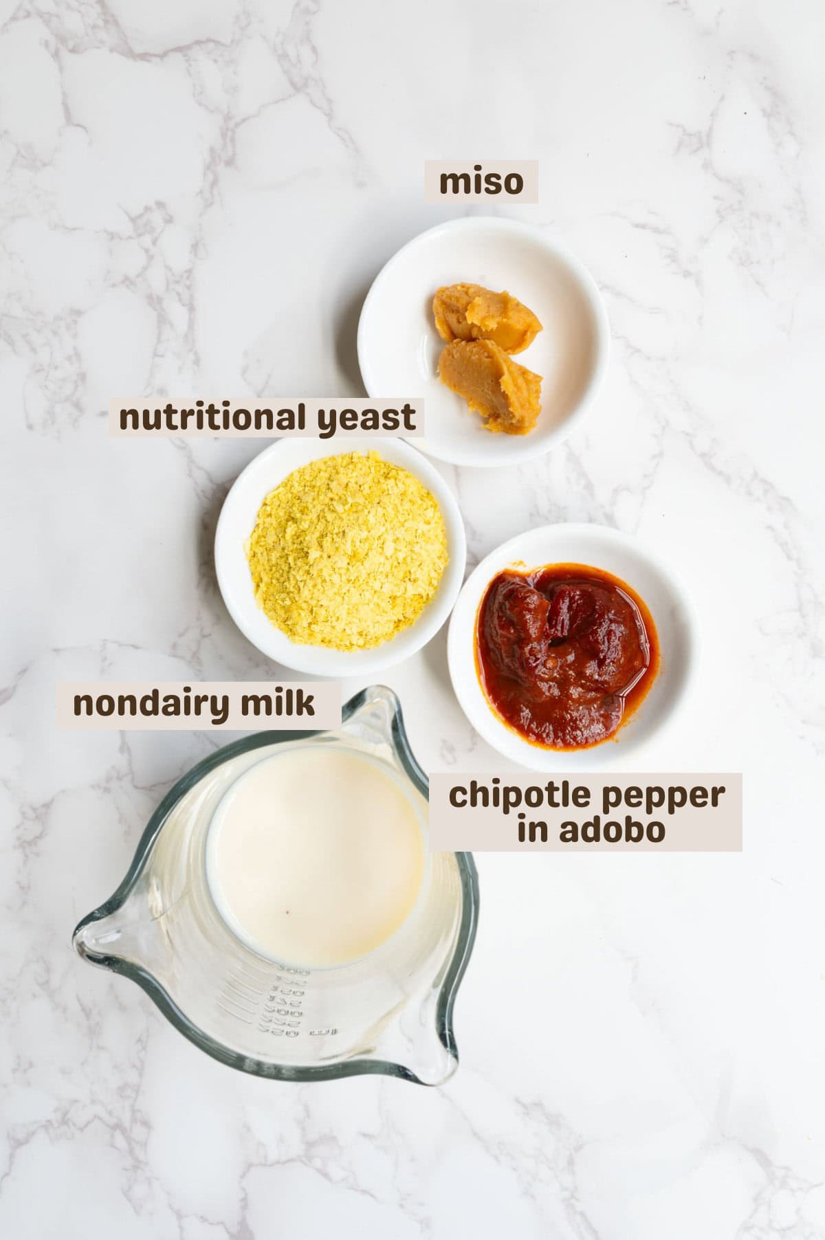 Miso, chipotle in adobo sauce, nondairy milk, and nutritional yeast.