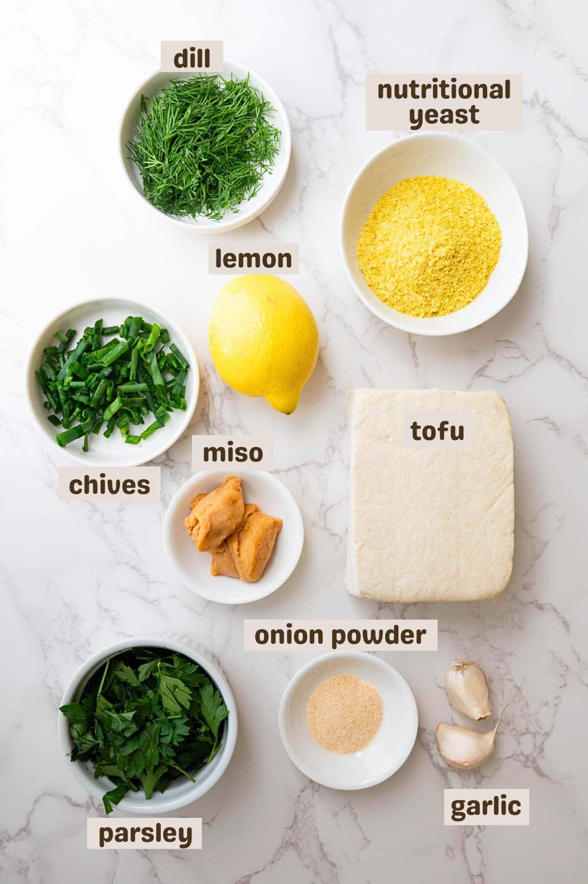 Tofu, nutritional yeast, lemon, fresh herbs, onion powder, and miso.