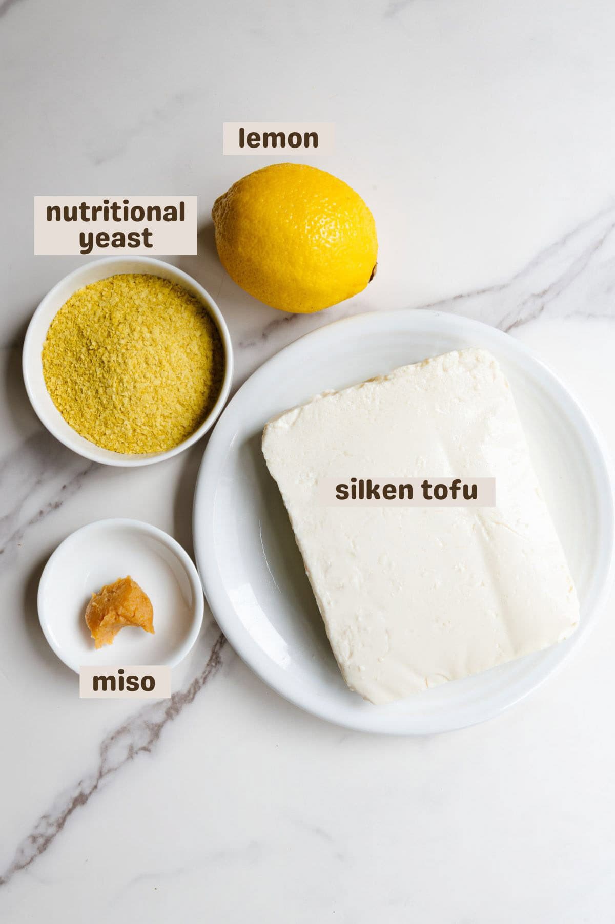 Lemon, silken tofu, miso, and nutritional yeast.