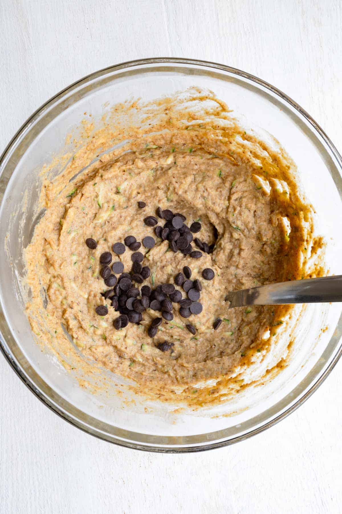 Batter in a bowl with chocolate chips.