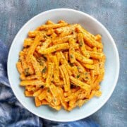Creamy butternut squash pasta sauce with pasta in a bowl.