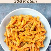 Creamy butternut squash pasta sauce with pasta in a bowl.