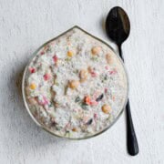 Mediterranean breakfast chia pudding with yogurt in a glass bowl.