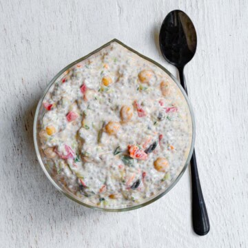 Mediterranean breakfast chia pudding with yogurt in a glass bowl.