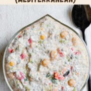 Mediterranean breakfast chia pudding with yogurt in a glass bowl.