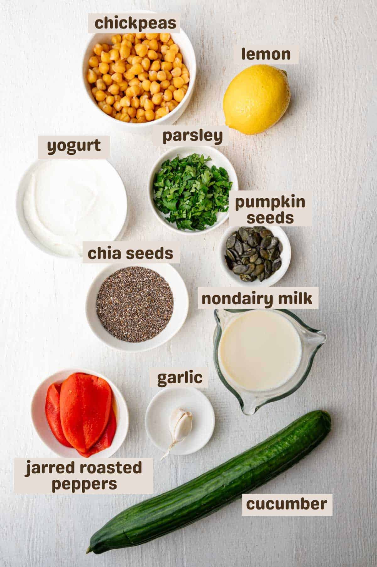 Chia seeds, chickpeas, pumpkin seeds, roasted red pepper, cucumber, chopped parsley, lemon, yogurt, and garlic.