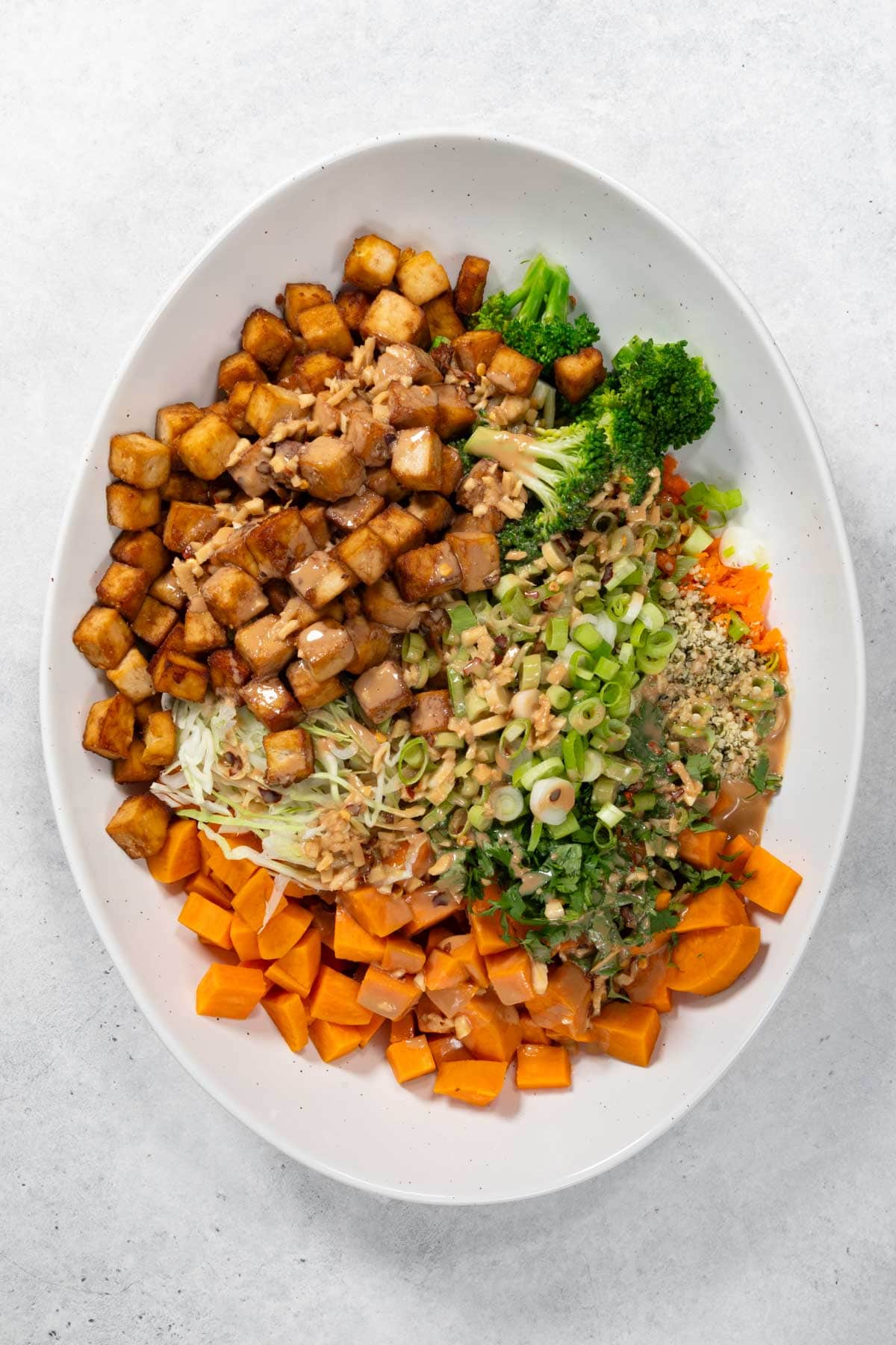 High-protein tofu buddha bowl in a white serving dish.