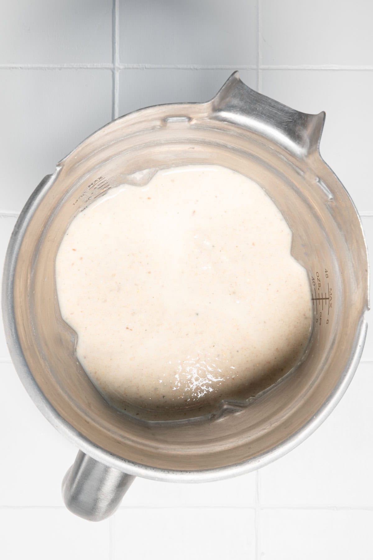 White creamy blended oats in a blender.