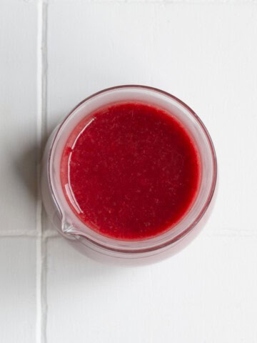 Healthy Balsamic Cranberry Dressing in a glass jar.