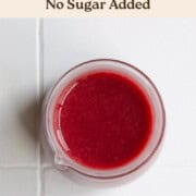 Healthy cranberry balsamic dressing in a glass jar.