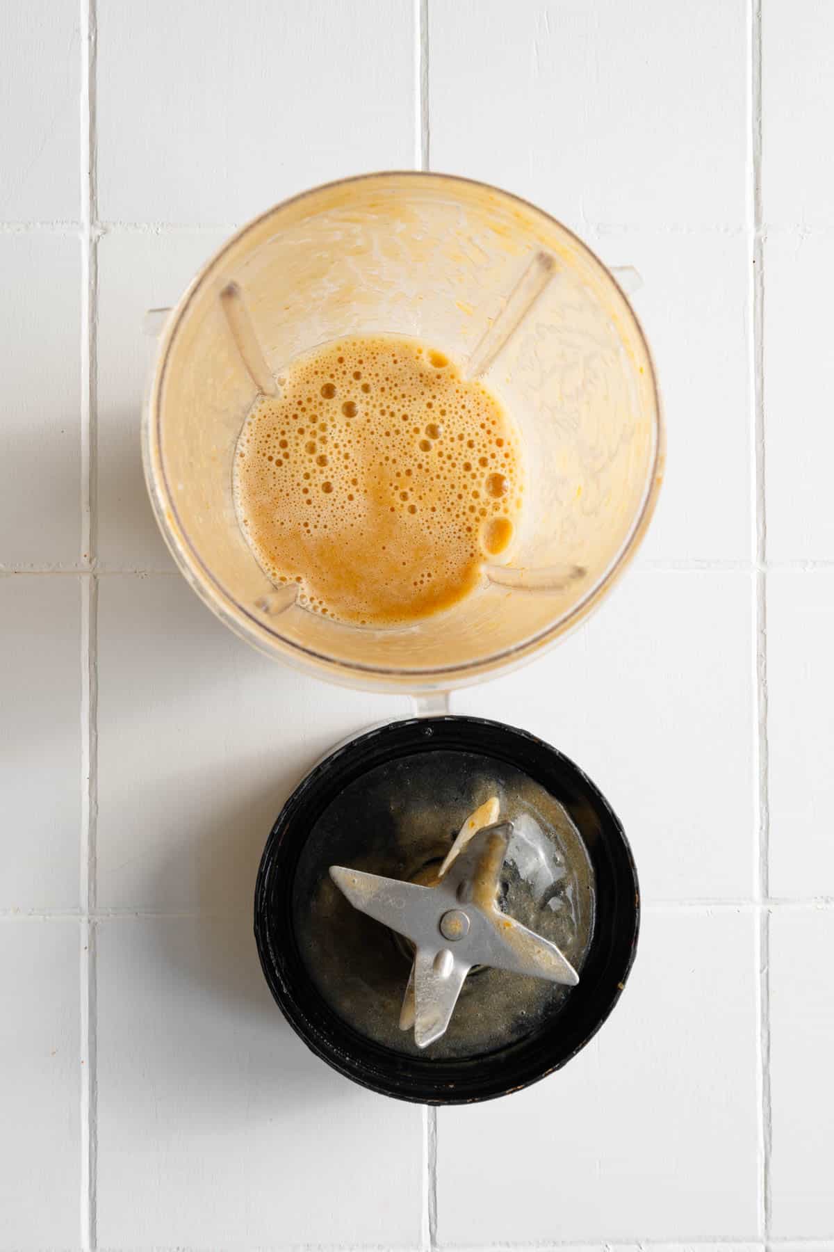 Blended dates in water in the canister of a blender.