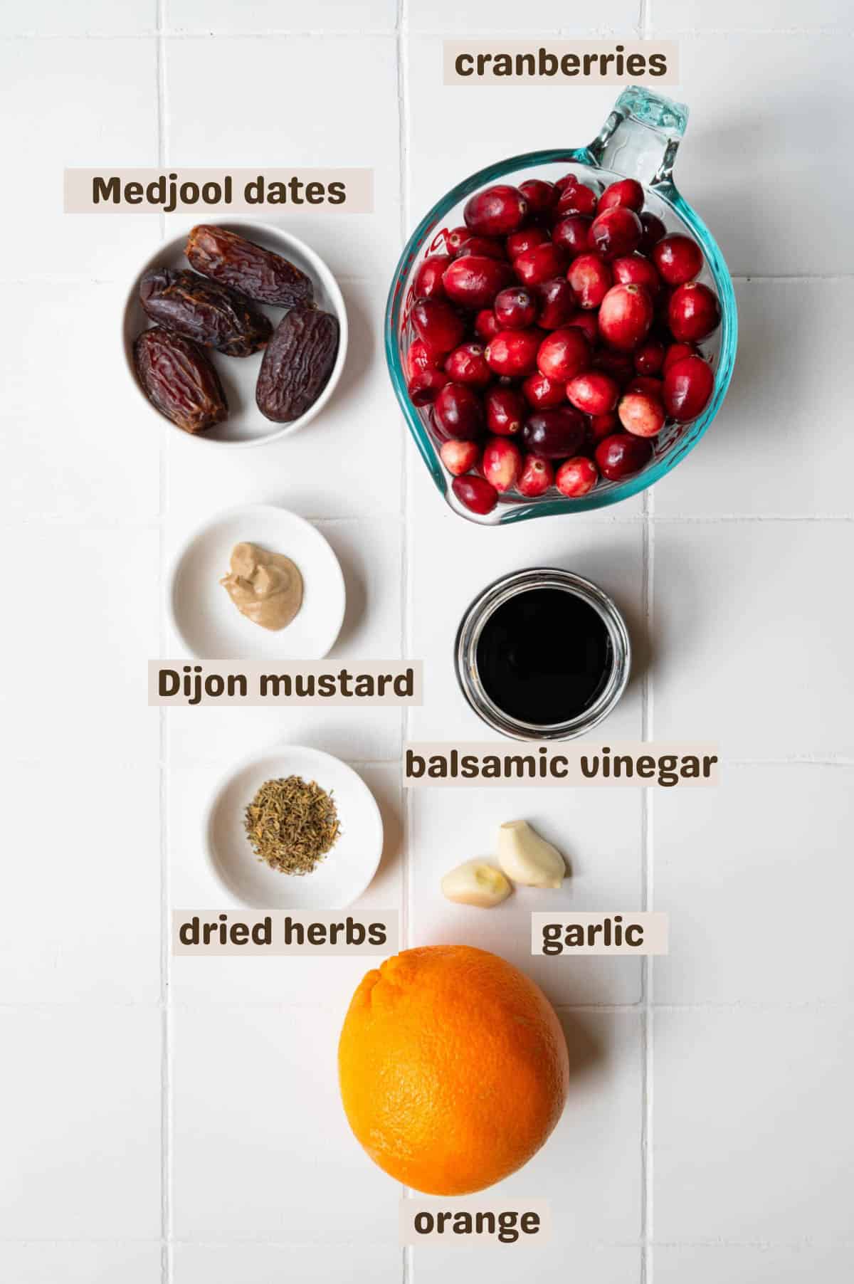 Fresh cranberries, orange, Medjool dates, dried herbs, garlic, Dijon mustard, and balsamic vinegar.