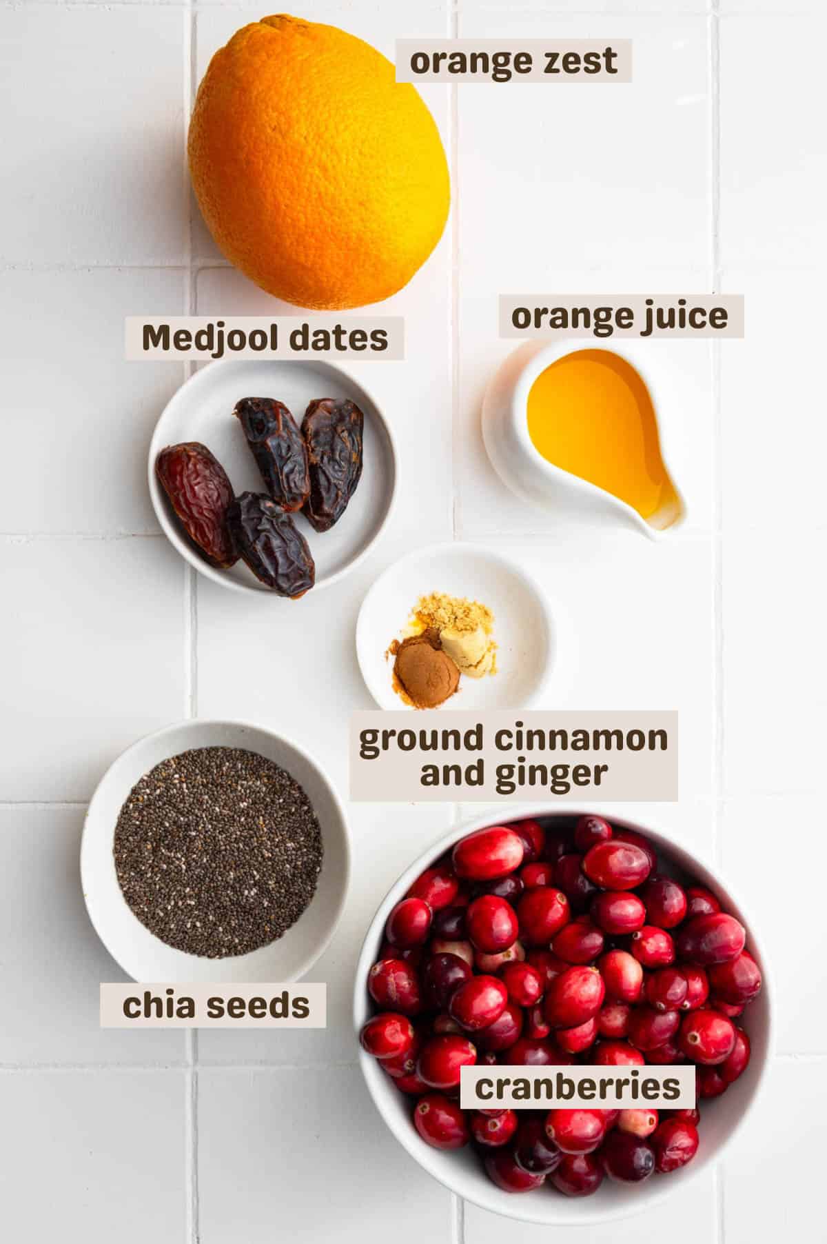 Orange, orange juice, Medjool dates, ground cinnamon, ground ginger, fresh cranberries, and chia seeds.
