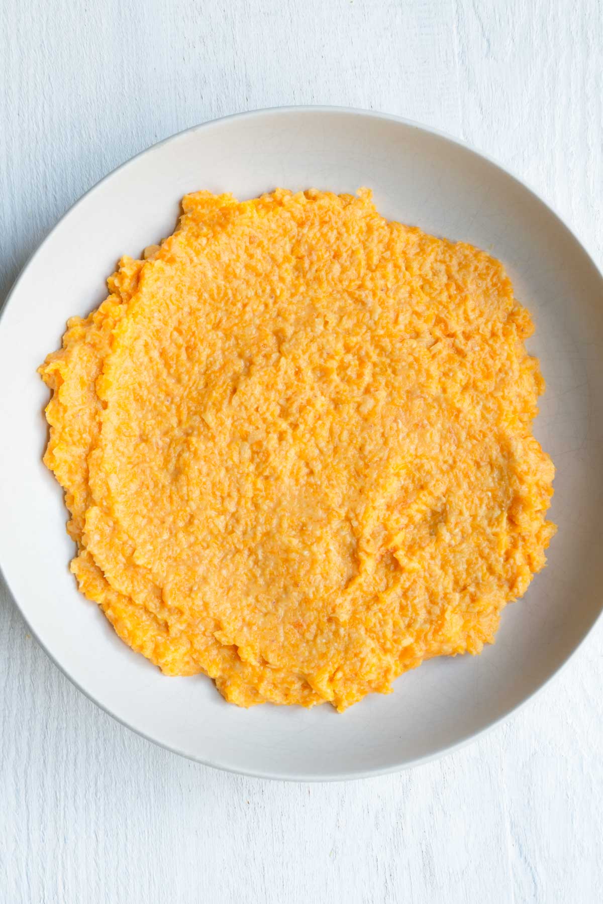 Mashed butternut squash and red lentils.