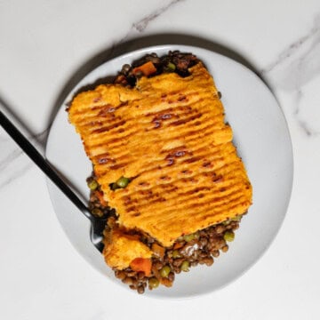 Vegetarian Lentil Shepherd's Pie on a plate with a fork.