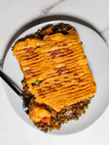 Vegetarian Lentil Shepherd's Pie on a plate with a fork.