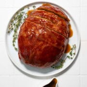 Thanksgiving Vegan Turkey on a white plate with gravy.