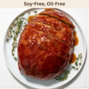 Thanksgiving Vegan Turkey on a white plate with gravy.