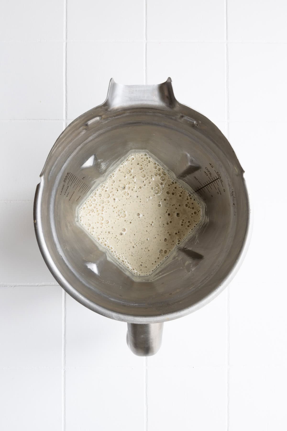 Blended cream sauce in a steel blender.