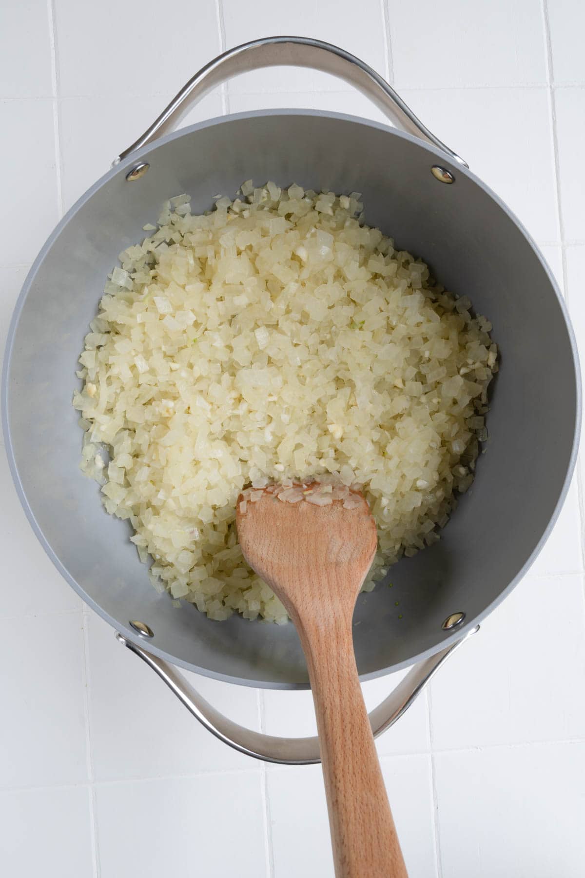 Softened cooked chopped onion and garlic in a saucepan.