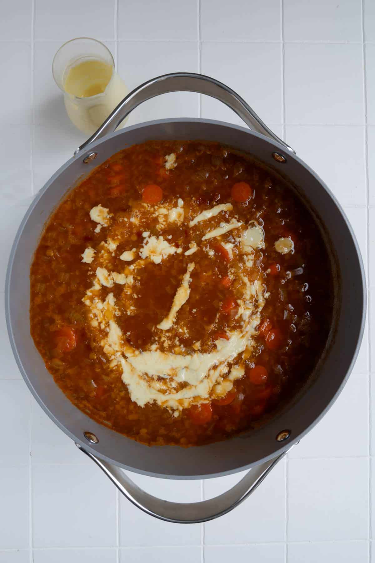 Soup with vegan cream in a saucepan.