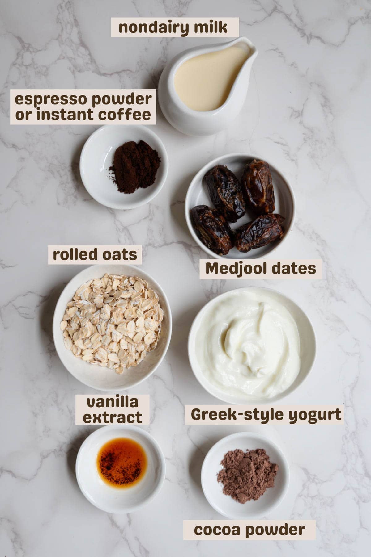 Cocoa powder, vanilla extract, Greek-style yogurt, rolled oats, dates, espresso powder, and nondairy milk.