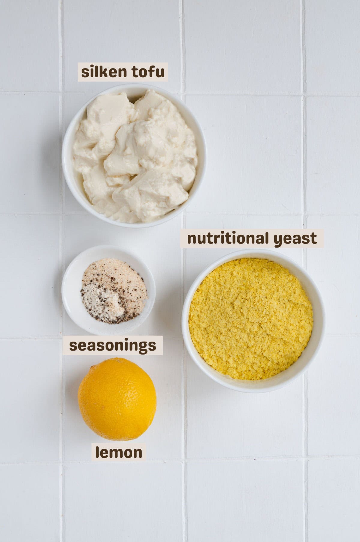 Silken tofu, nutritional yeast, seasoning, and lemon.