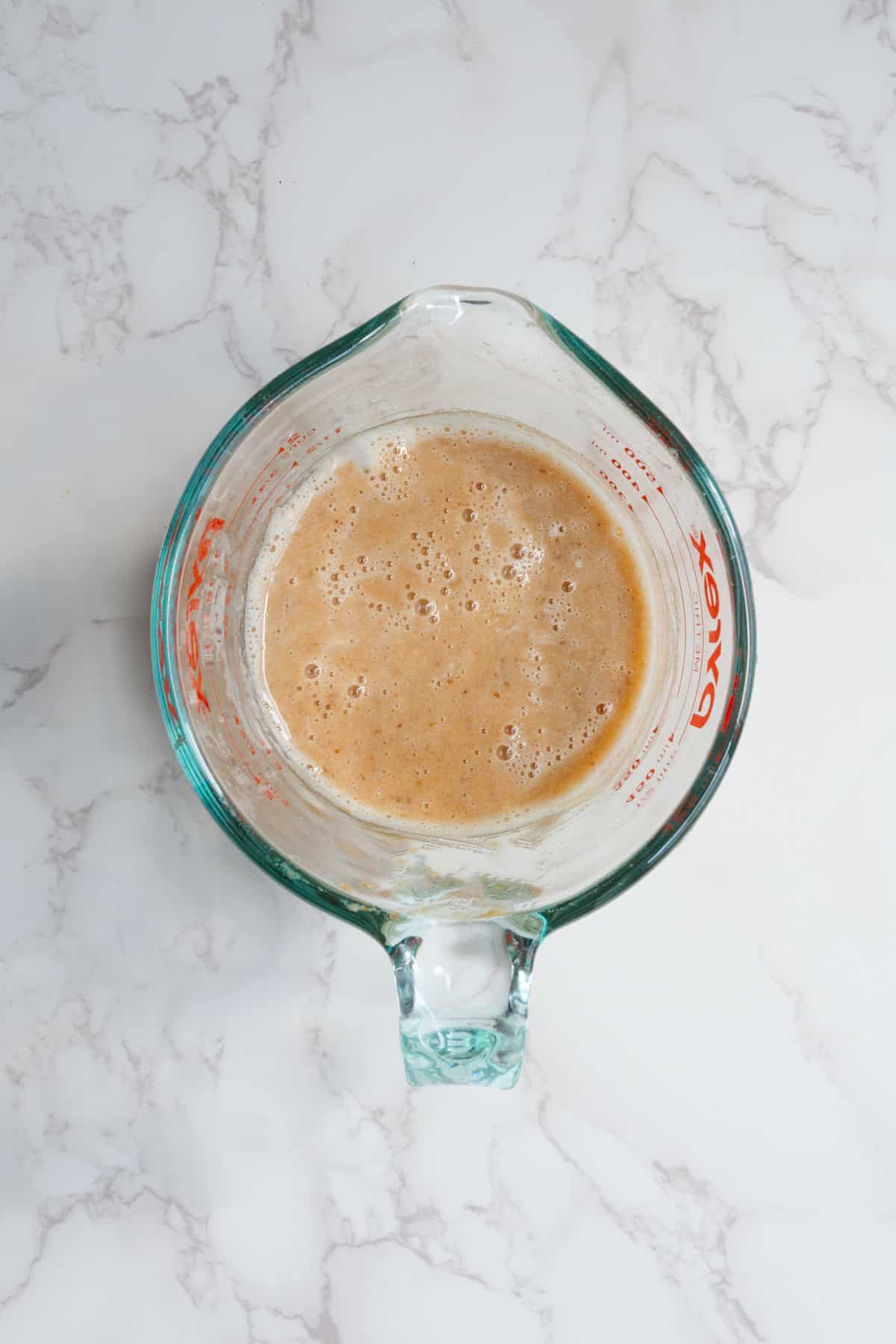 Date caramel in a Pyrex measuring cup.