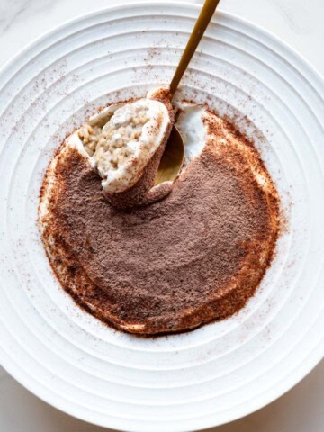 Tiramisu oats in a white bowl.