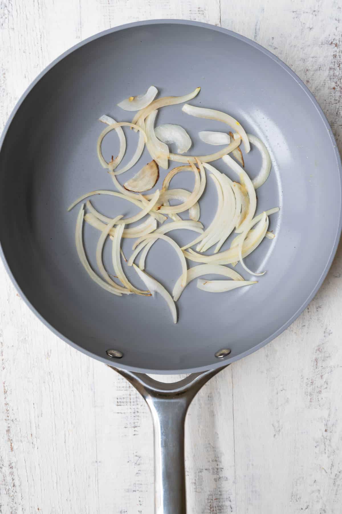Lightly browned onion in a skillet.